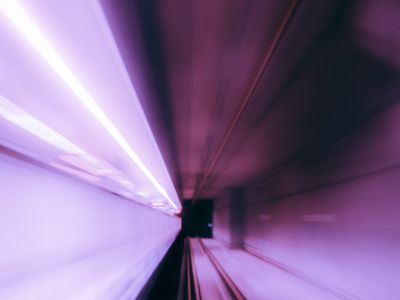 Abstract motion blur of light trails in purple color