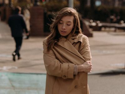 Close up of a person meditating in a dark room
